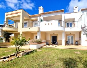 a large villa with a yard in front of it at Villa Marcia Home - Nature, Golf, Beaches-Lagos in Portimão