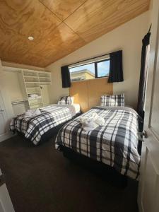 A bed or beds in a room at Country Retreats On Ranzau 0