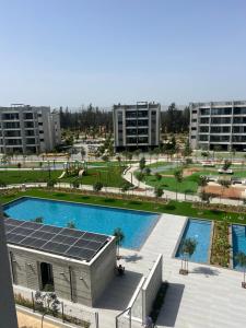 an overhead view of a swimming pool in a city at Sunset Gardens - Holiday Apartments - by TLV Living in Limassol +52 photos