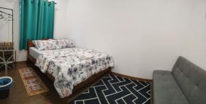 Postel nebo postele na pokoji v ubytování Z&S Gerik Hillview Homestay