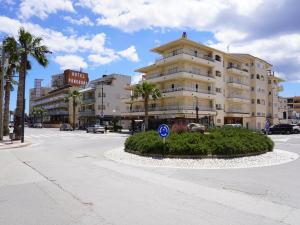 a city street with a building and a street sign at Elisa - L'Estartit, Centro - ES-323-85 in Torroella de Montgrí