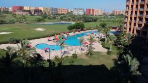 an aerial view of a pool at a resort at شالية مميز للإيجار Porto golf بورتو جولف مارينا in El Alamein +8 photos