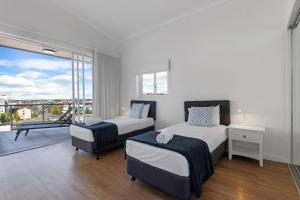 Letto o letti in una camera di Pandanus Mooloolaba