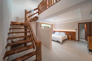 Postel nebo postele na pokoji v ubytování Fuxi-21 Homestay