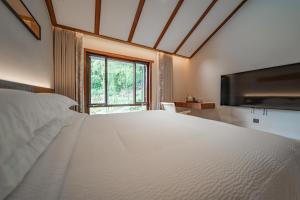 Postel nebo postele na pokoji v ubytování Fuxi-21 Homestay
