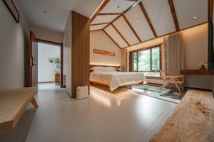 Postel nebo postele na pokoji v ubytování Fuxi-21 Homestay