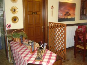 a room with a table with a tablecloth on it at Petropanagia in Elatochori +53 photos