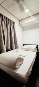 Ένα ή περισσότερα κρεβάτια σε δωμάτιο στο Four Seasons Hostel