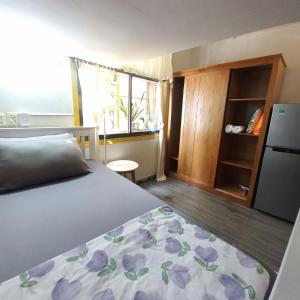 Ένα ή περισσότερα κρεβάτια σε δωμάτιο στο Cute Duplex