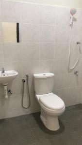a bathroom with a toilet and a sink at Zaz cottage Langkawi in Pantai Cenang