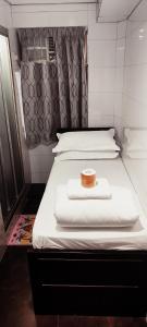 Ένα ή περισσότερα κρεβάτια σε δωμάτιο στο Four Seasons Hostel