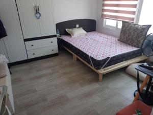 Postel nebo postele na pokoji v ubytování Ocean House - Ipjang
