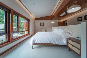 Postel nebo postele na pokoji v ubytování Fuxi-21 Homestay