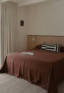 a bedroom with a large bed with two pillows on it at The Blackwood House in Rye