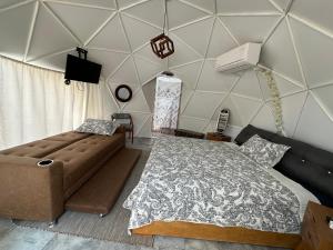 Ένα ή περισσότερα κρεβάτια σε δωμάτιο στο Glamping El Encanto