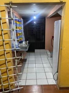 a bathroom with a sink in a room at Hotel Plaza in San Martín Texmelucan de Labastida