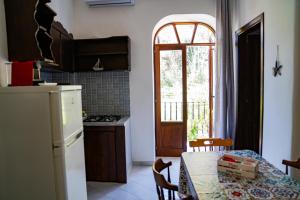 Kuchyň nebo kuchyňský kout v ubytování NIMA Holidays Home + 37 fotografií