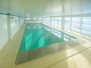 The swimming pool at or close to Apartment with sea view and shared pool