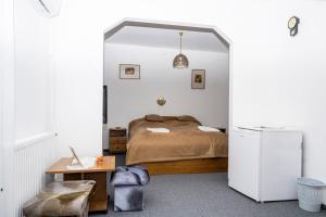 Postel nebo postele na pokoji v ubytování Kokó Panzió