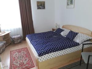Postel nebo postele na pokoji v ubytování Kokó Panzió
