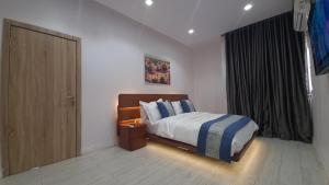 Ένα ή περισσότερα κρεβάτια σε δωμάτιο στο Seaview Apartment, Ikoyi