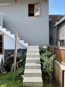 a set of stairs leading to a house at Gemyah in Glagah