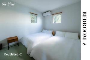 Postel nebo postele na pokoji v ubytování theView 南房総