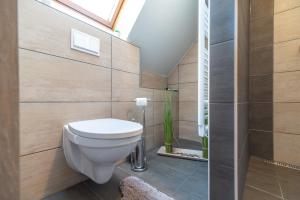Kúpeľňa v ubytovaní Buzavirág Apartman