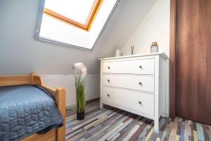 Posteľ alebo postele v izbe v ubytovaní Buzavirág Apartman