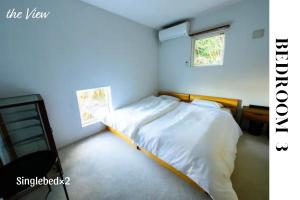 Postel nebo postele na pokoji v ubytování theView 南房総