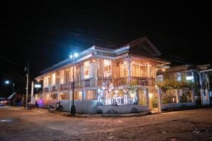 a building with lights on it at night at 1898 Casa and Restaurante in Silay