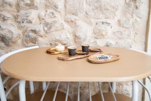 a table with two coffee cups on top of it at Casuzze SPA in Modica
