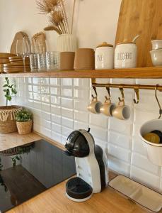 a coffee maker on a counter in a kitchen at La Mansarda sul Mare in Montesilvano