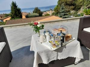 a tray of food on a table on a patio at Luluxuryhouse in Trevignano Romano