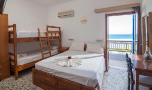Letto o letti in una camera di Minoa sea rooms