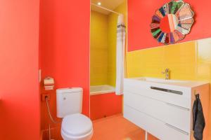 a bathroom with a toilet and a sink at La ferme des Pommés in Pommera +43 photos