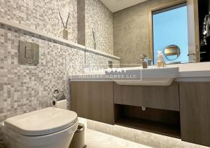 a bathroom with a white toilet and a sink at Harmonious 3BR in Stella Maris, Sea View, Marina in Dubai