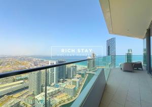 a balcony with a view of a city at Harmonious 3BR in Stella Maris, Sea View, Marina in Dubai
