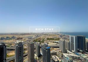 an aerial view of a city with tall buildings at Harmonious 3BR in Stella Maris, Sea View, Marina in Dubai