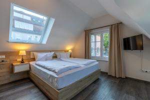 Postel nebo postele na pokoji v ubytování Hotel Polar-Stern + 37 fotografií