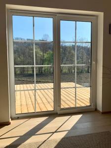 an empty room with a large sliding glass door at Villa Amelie' Wochenend- und Ferienhaus in Heimschuh