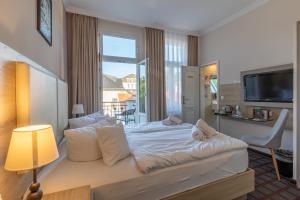 Postel nebo postele na pokoji v ubytování Hotel Polar-Stern