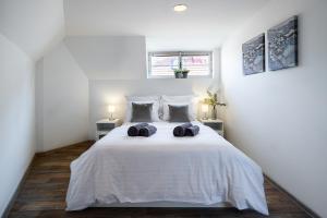 Postel nebo postele na pokoji v ubytování Apartmány u Vlašského dvora