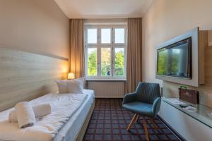 Postel nebo postele na pokoji v ubytování Hotel Polar-Stern