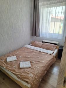 Postel nebo postele na pokoji v ubytování Nikolett apartman