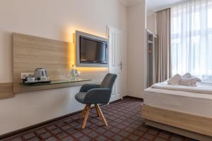 Postel nebo postele na pokoji v ubytování Hotel Polar-Stern