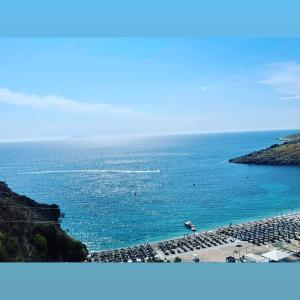 a view of a body of water with a beach at Himara luxury apartments in Himare