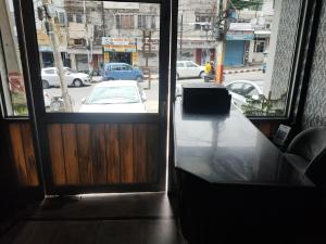 a view of a street from a room with a window at hotel sunny international in Jammu