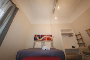 A bed or beds in a room at Sotto il Castello B&B