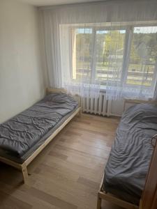 Postel nebo postele na pokoji v ubytování Alajaama 8-6